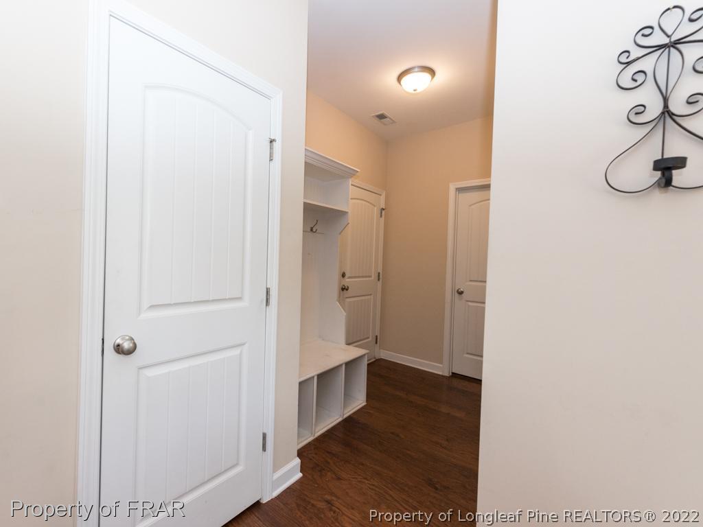 717 St Johns Loop Raeford, NC 28376 - Photo 5 of 29 a view of a hallway with wooden floor