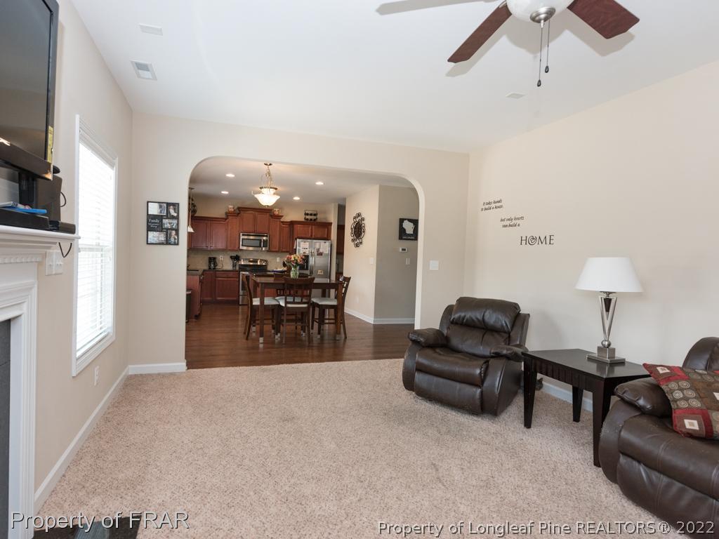 717 St Johns Loop Raeford, NC 28376 - Photo 9 of 29 a living room with furniture and a flat screen tv
