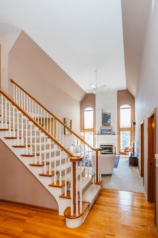 a view of entryway and hall with wooden floor