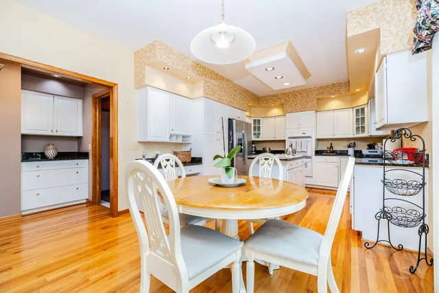 a view of a dining room with furniture and wooden floor