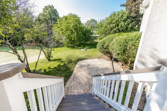 a view of a balcony with wooden fence