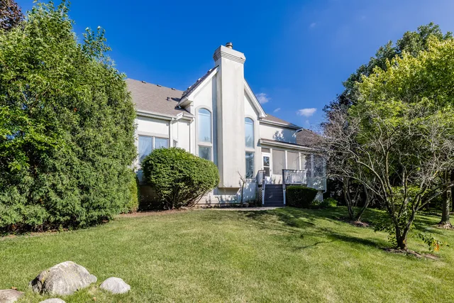 a view of a house with a backyard