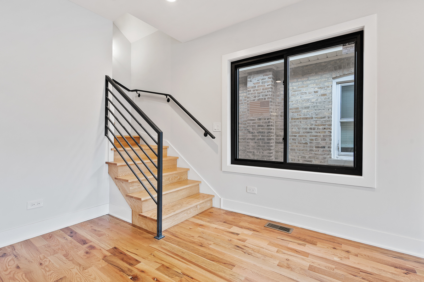 3529 North Nottingham Avenue Chicago, IL 60634 - Photo 17 of 33 a view of staircase with wooden floor and a window