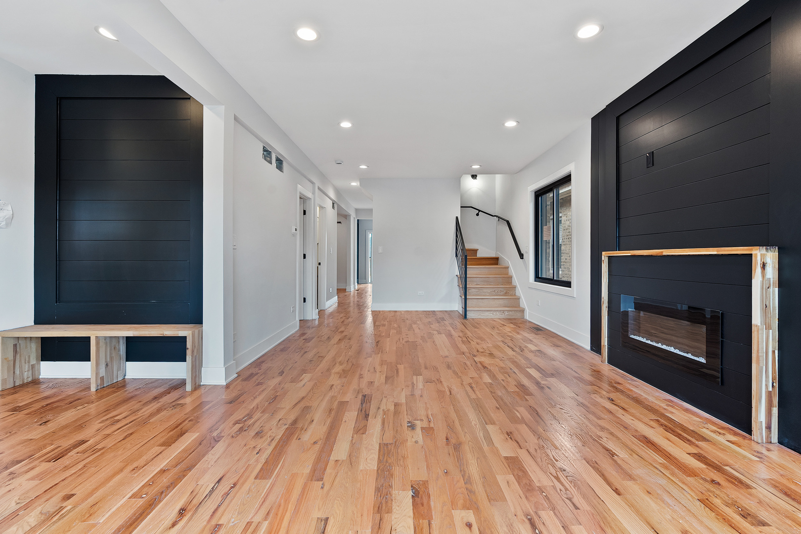 3529 North Nottingham Avenue Chicago, IL 60634 - Photo 3 of 33 a view of a hallway with wooden floor and a fireplace