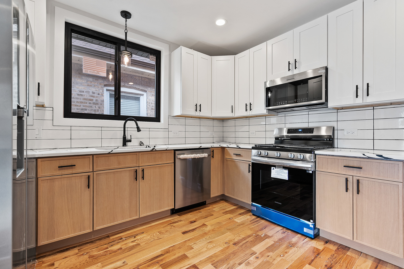 3529 North Nottingham Avenue Chicago, IL 60634 - Photo 8 of 33 a kitchen with stainless steel appliances granite countertop a sink stove and microwave