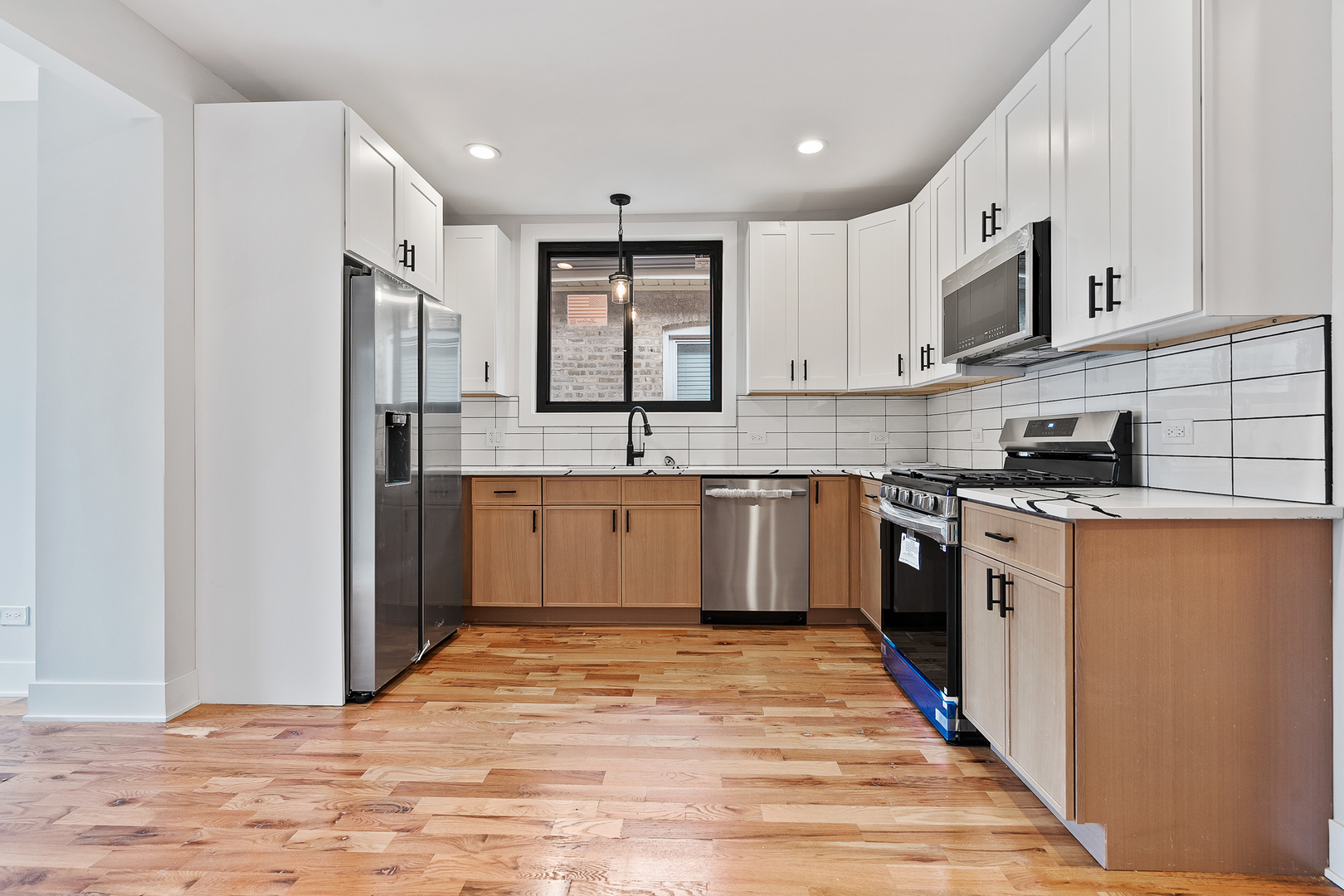 3529 North Nottingham Avenue Chicago, IL 60634 - Photo 9 of 33 a kitchen with stainless steel appliances granite countertop a stove a sink and a refrigerator