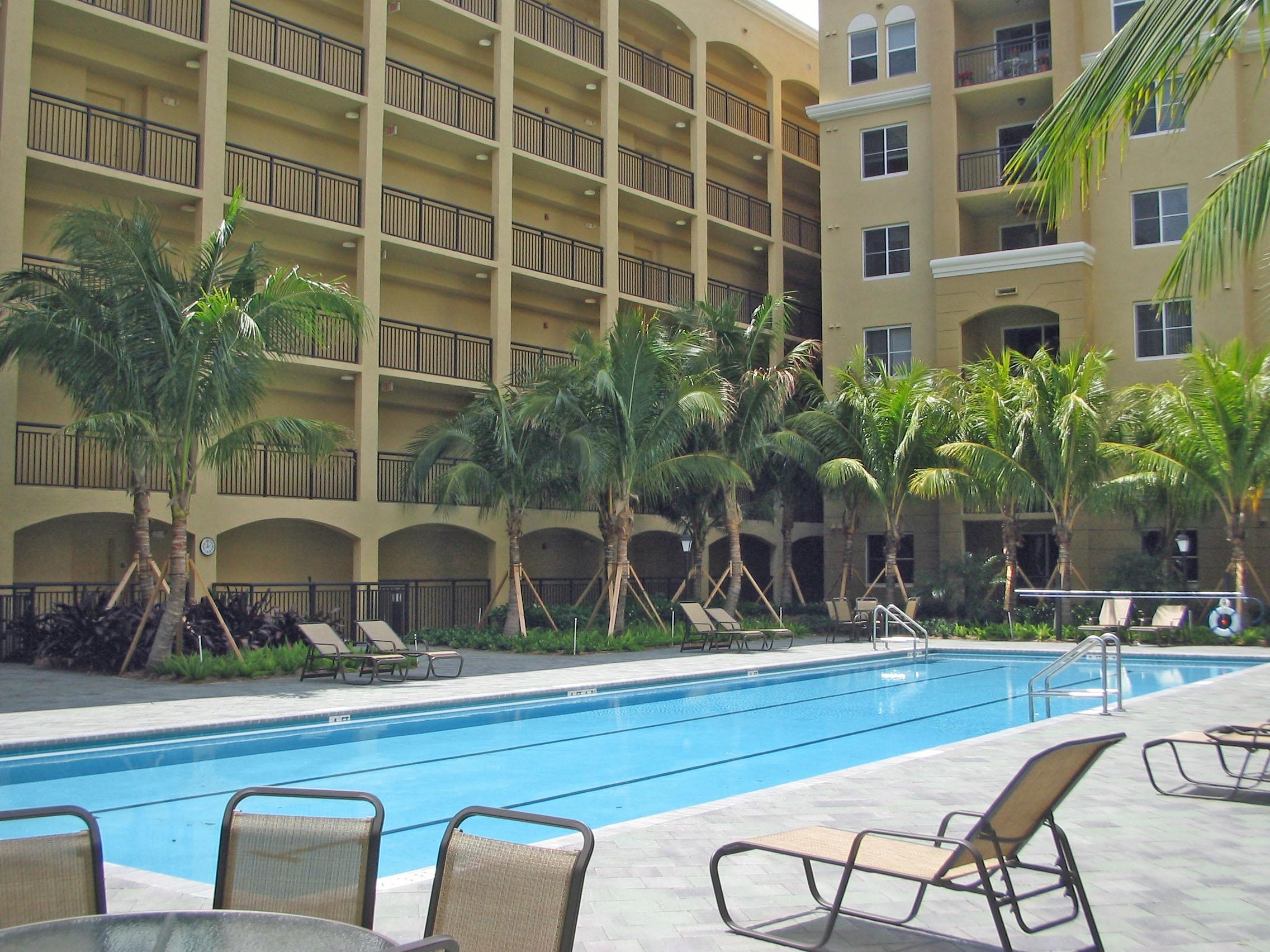 1690 Renaissance Commons Boulevard, Unit 1629 Boynton Beach, FL 33426 - Photo 11 of 18 a view of a chairs and table in a patio
