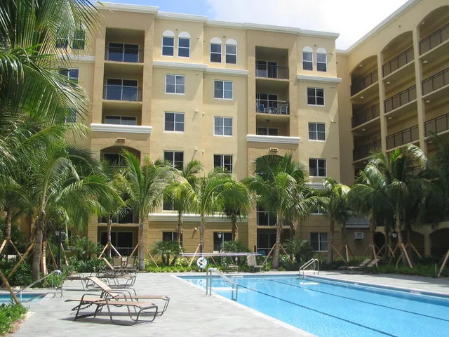 a front view of a building with garden