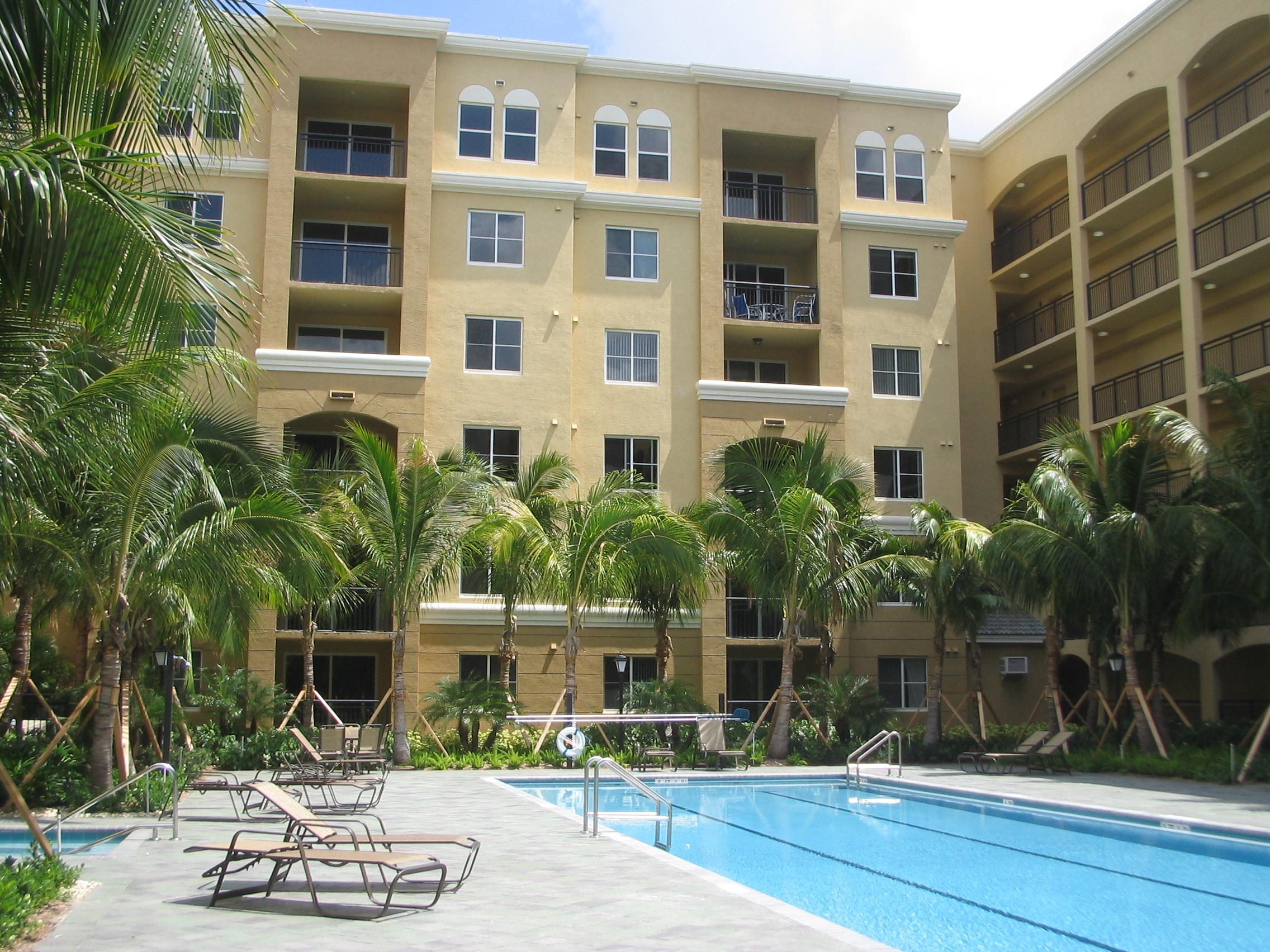 1690 Renaissance Commons Boulevard, Unit 1629 Boynton Beach, FL 33426 - Photo 12 of 18 a front view of a building with garden
