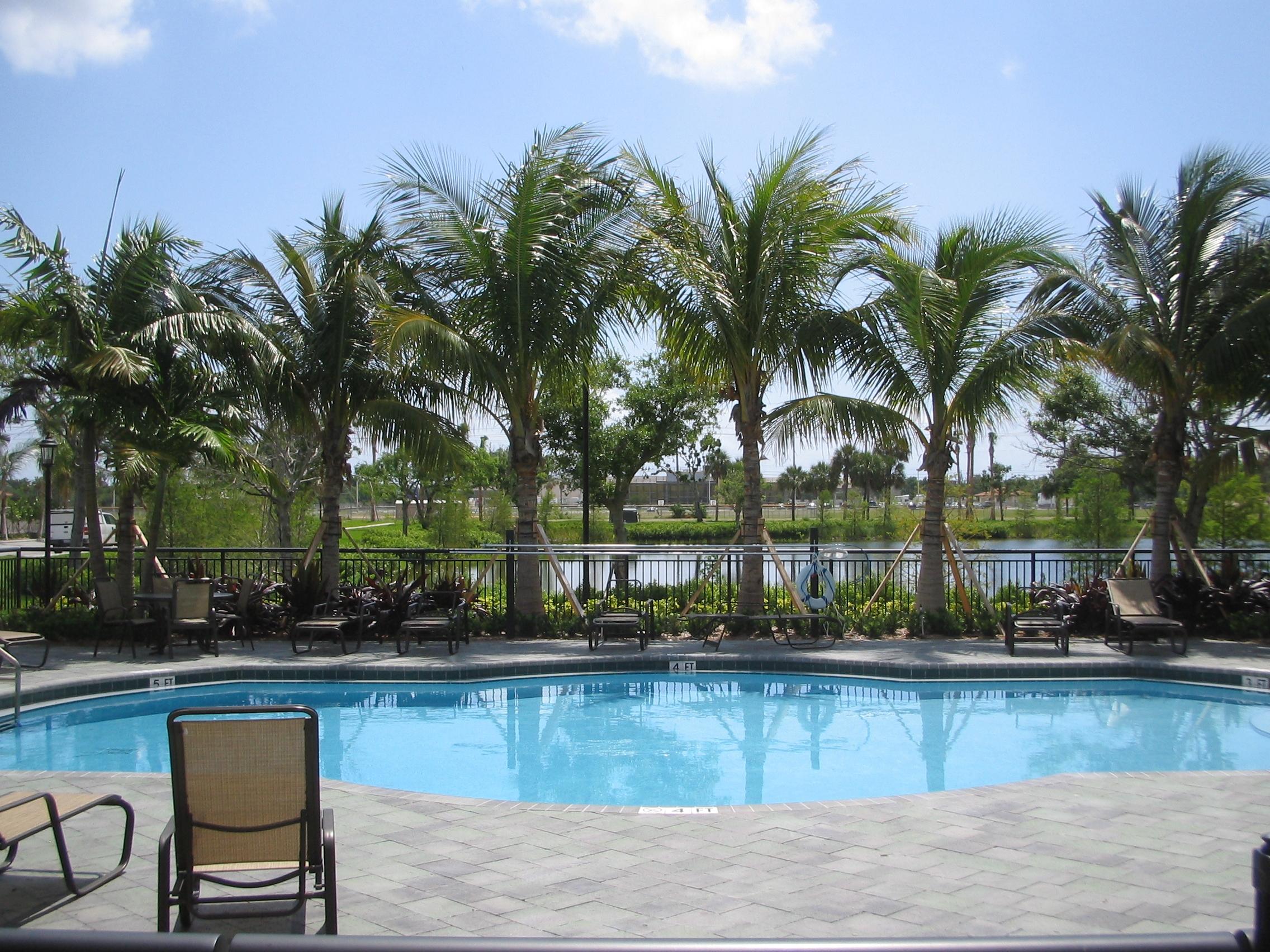 1690 Renaissance Commons Boulevard, Unit 1629 Boynton Beach, FL 33426 - Photo 13 of 18 a view of a swimming pool with a patio