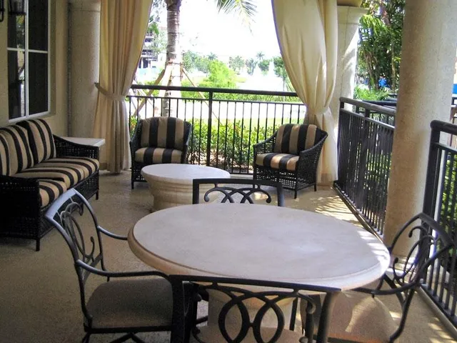 a outdoor dining space with furniture and outdoor view