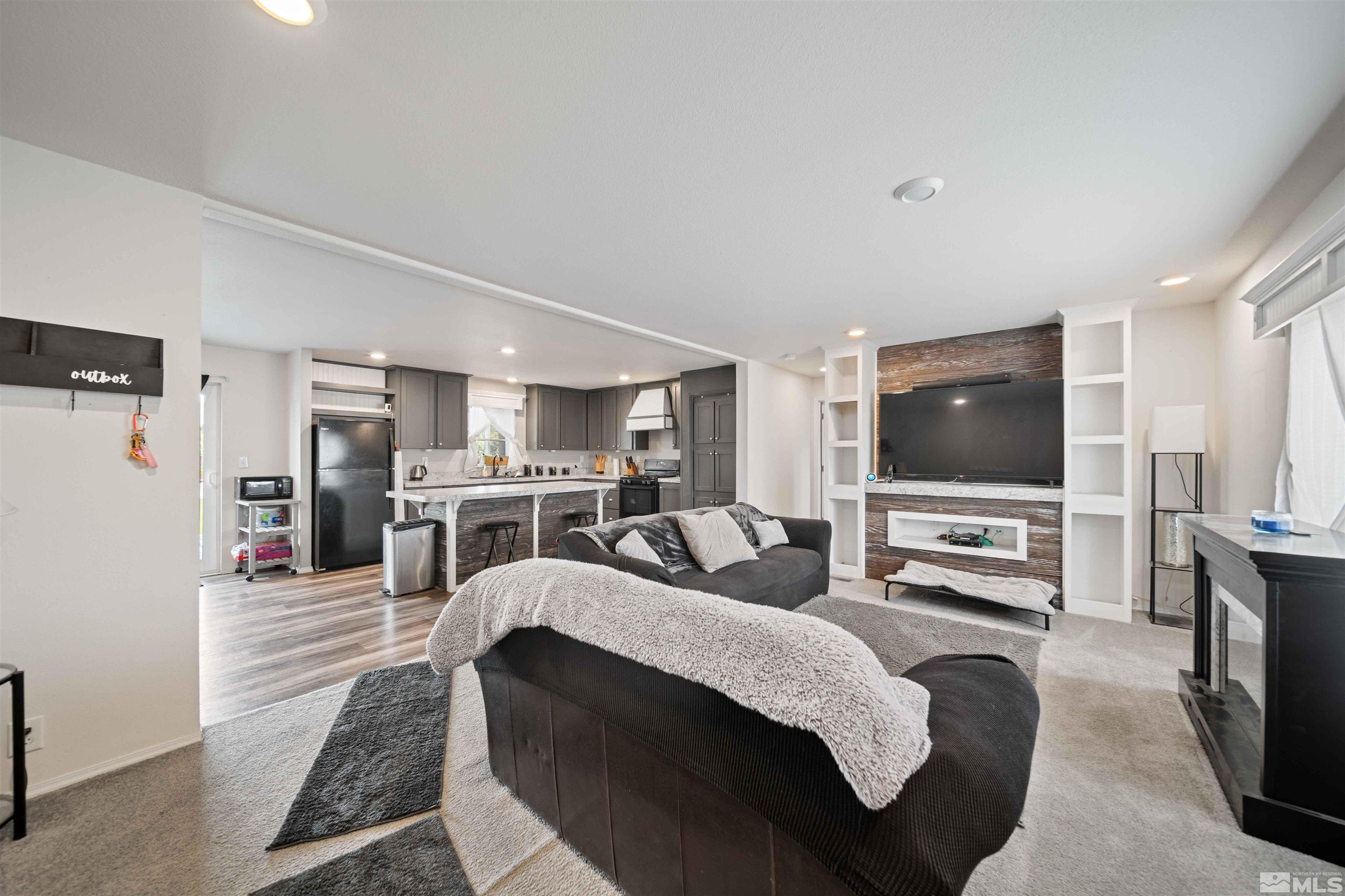 4020 Grouse Way Reno, NV 89508 - Photo 1 of 28 a living room with furniture and a flat screen tv