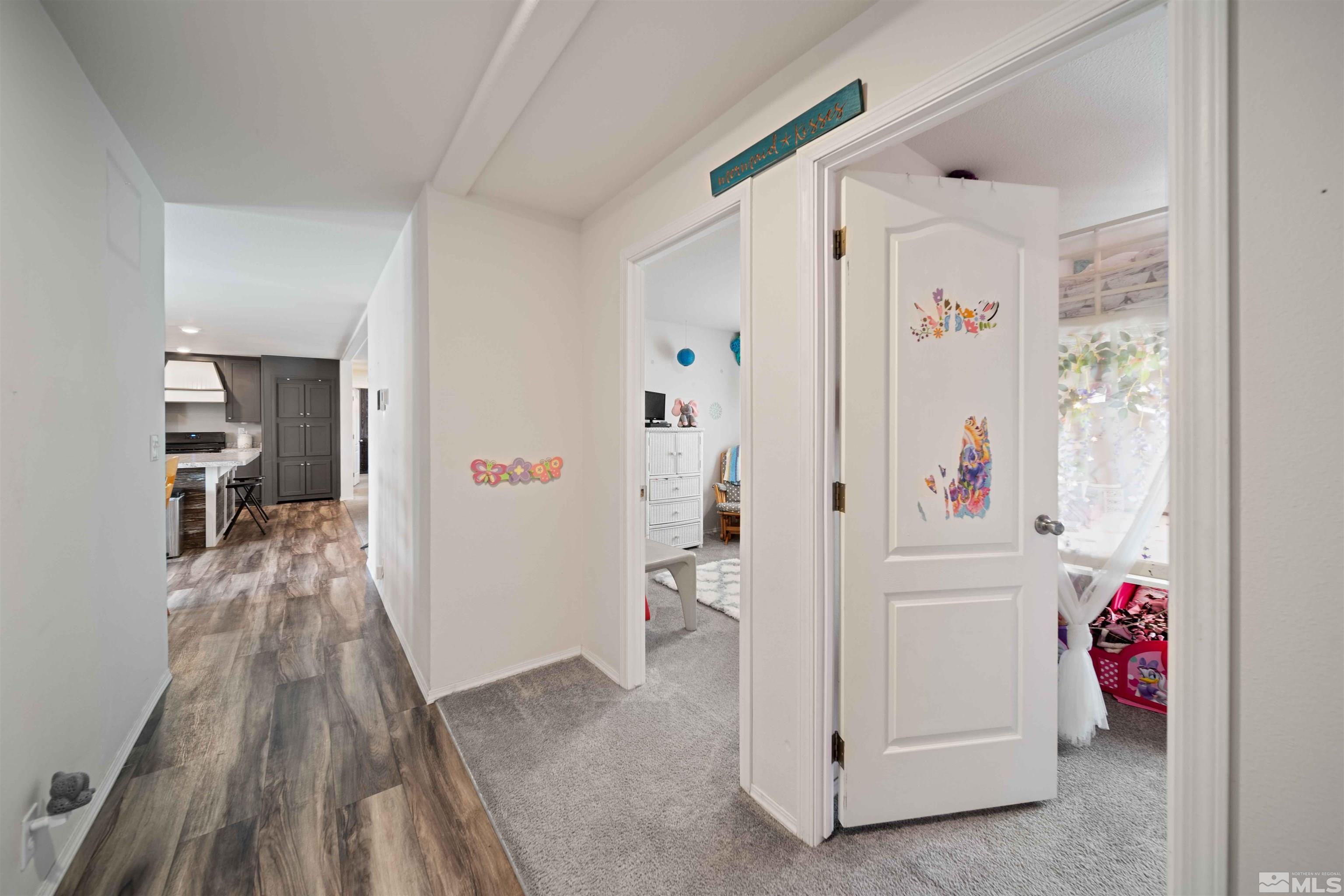 4020 Grouse Way Reno, NV 89508 - Photo 11 of 28 a view of hallway with wooden floor and furniture