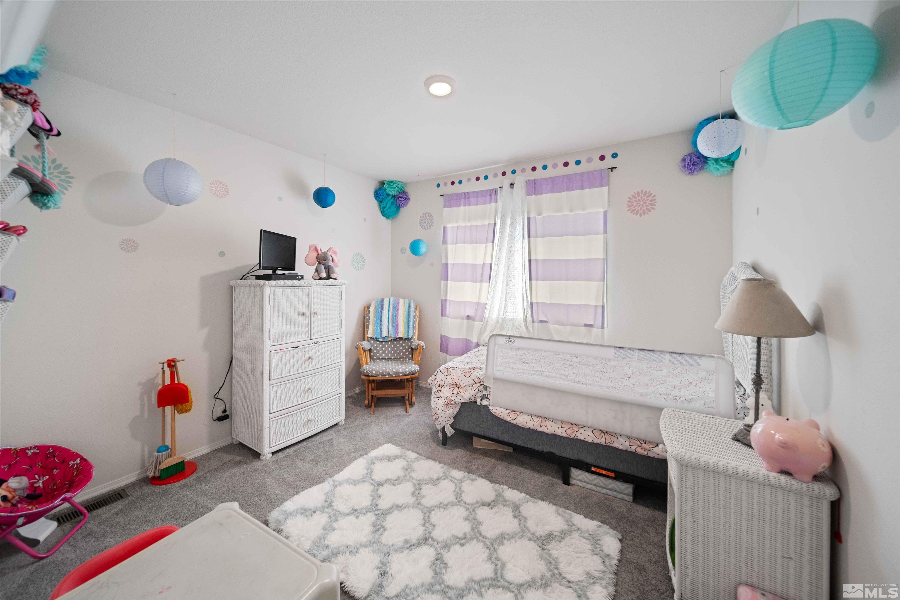 4020 Grouse Way Reno, NV 89508 - Photo 7 of 28 a bedroom with a bed and a window