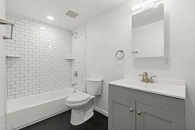 an empty room with a workbench and a window