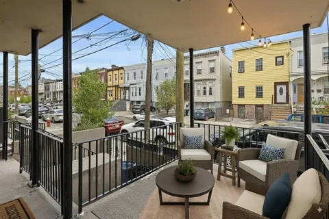 a view of a patio with couches chairs dining table and chairs