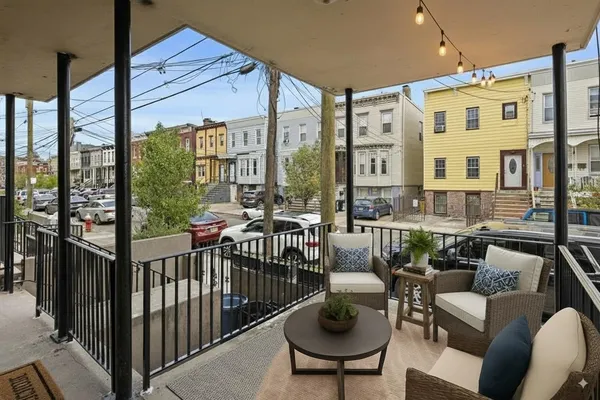 a view of a patio with couches chairs dining table and chairs
