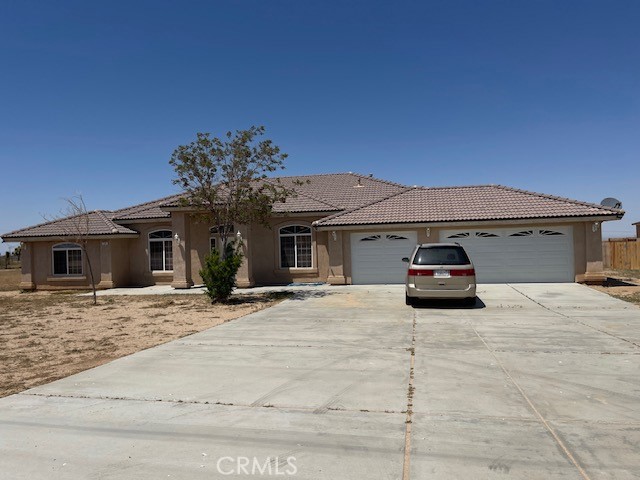 7380 Luna Road Phelan, CA 92371 - Photo 1 of 1 a view of a car parked in front of a house