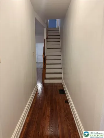 a view of entryway with wooden floor