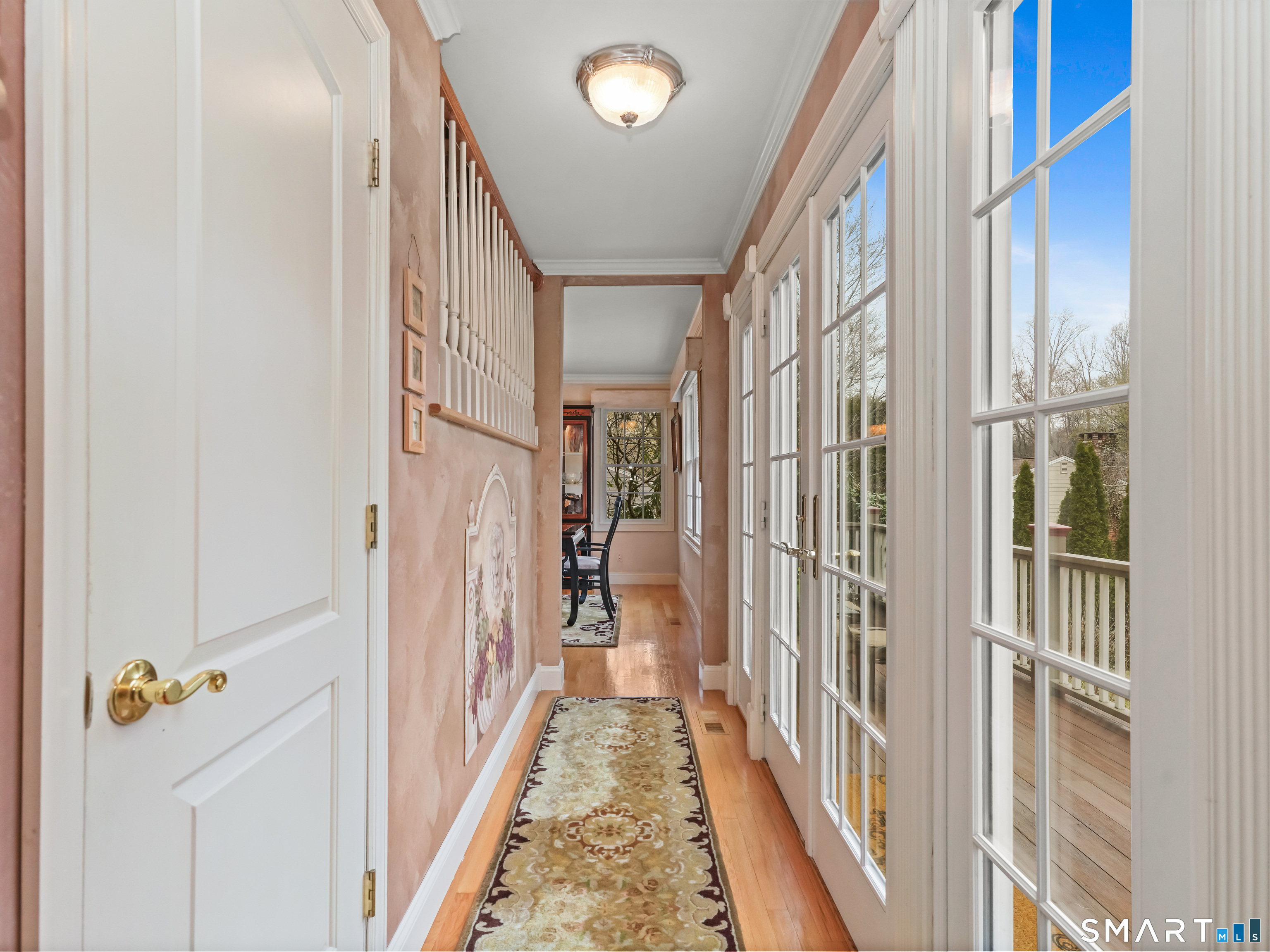 82 Ramapoo Road Ridgefield, CT 06877 - Photo 31 of 40 a view of a hallway with wooden floor and staircase