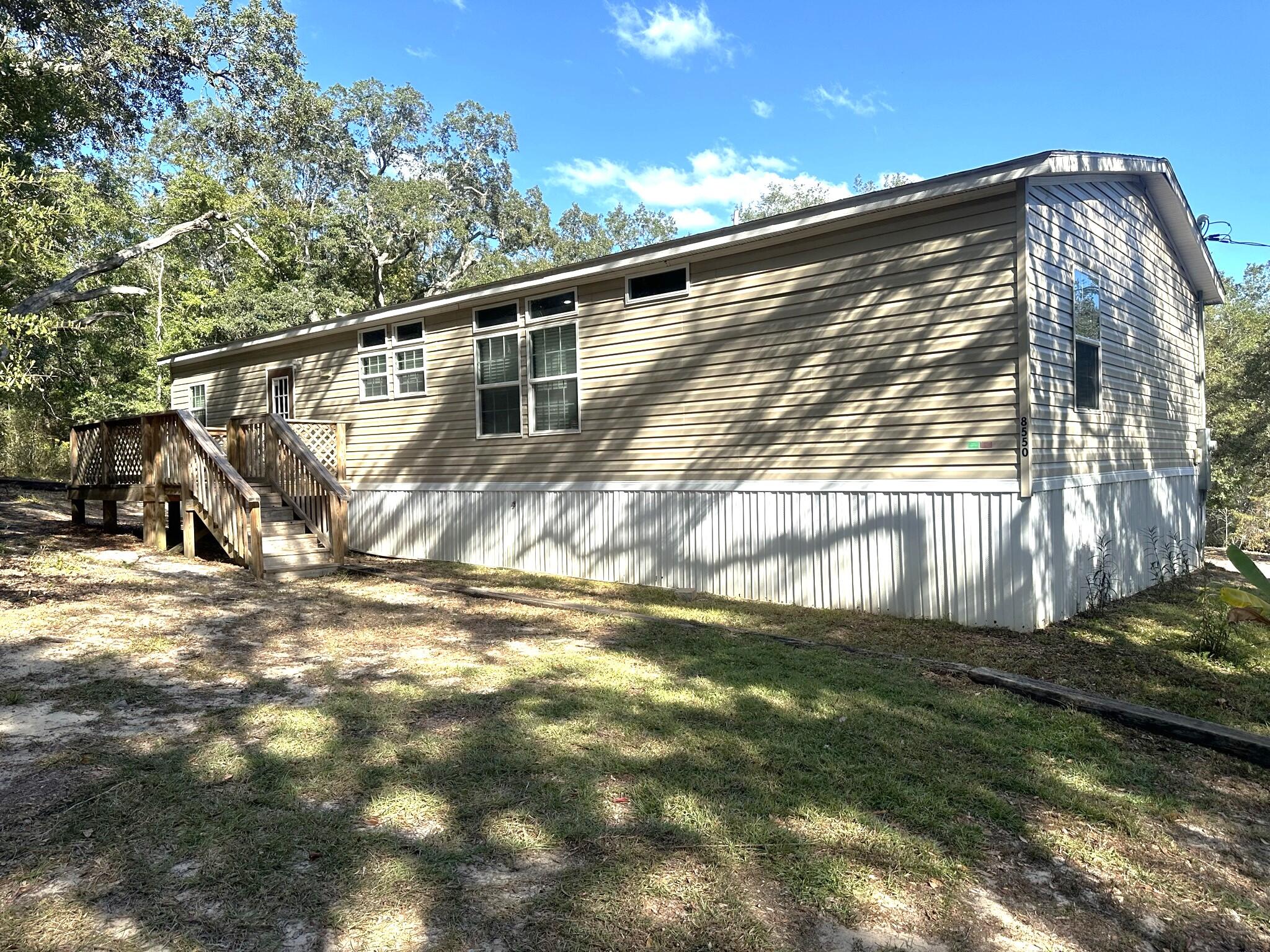 8550 Noah Hurst Road Navarre, FL 32566 - Photo 2 of 31 3. Back of Home