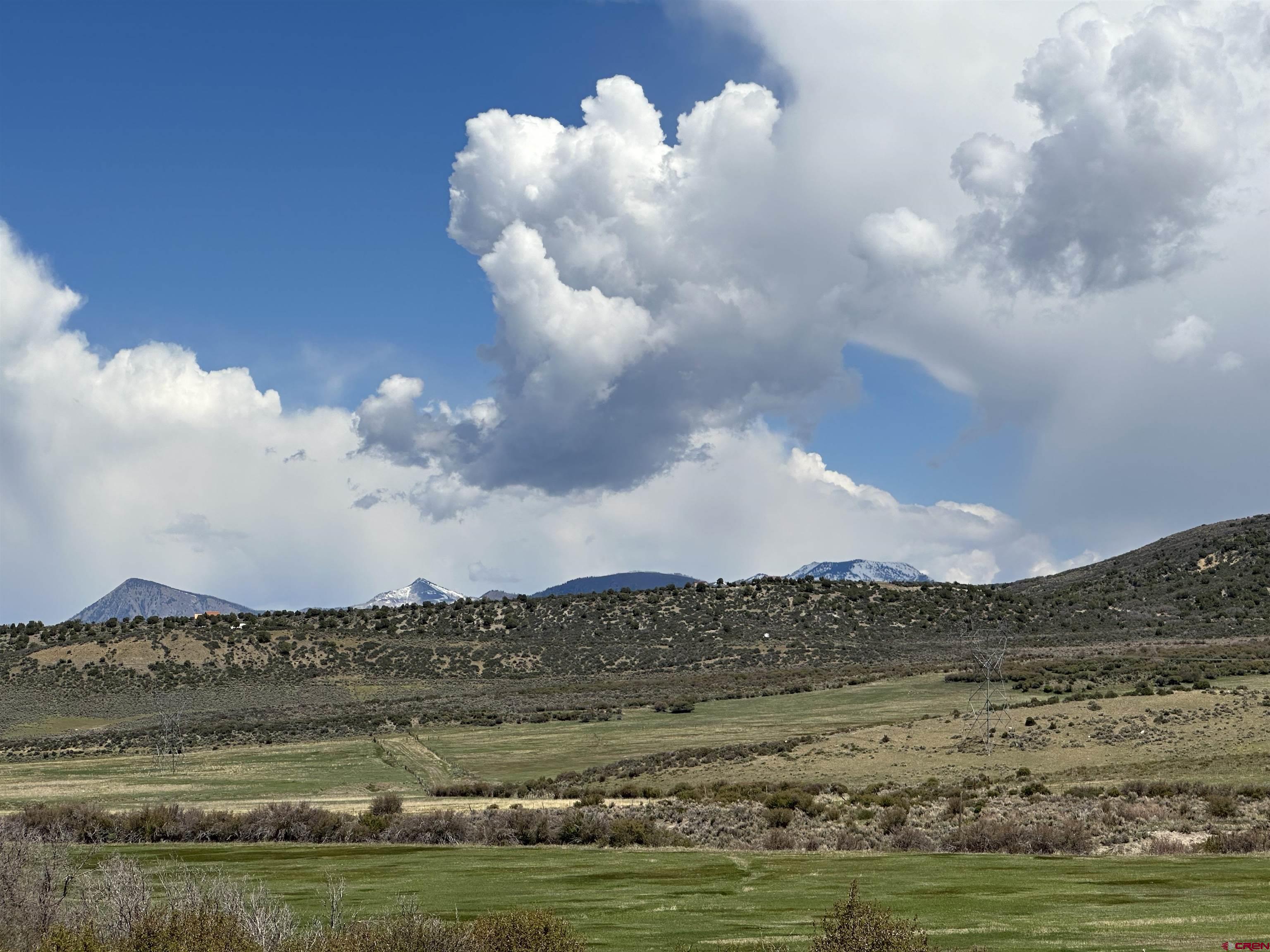 8896 8250th Road Crawford, CO 81415 - Photo 19 of 37 a view of a lake with a mountain in the background