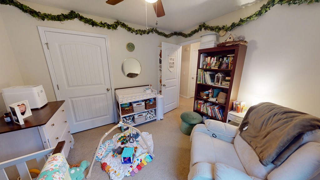5260 Kingsberry Lane Columbus, GA 31907 - Photo 11 of 23 a living room with furniture and a book shelf