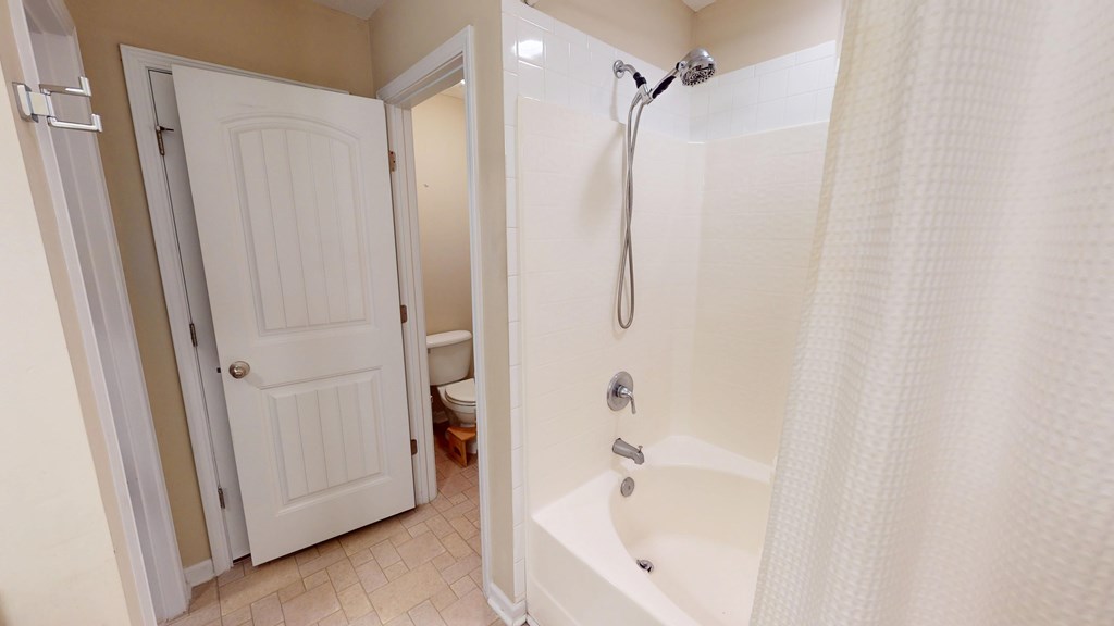 5260 Kingsberry Lane Columbus, GA 31907 - Photo 17 of 23 a bathroom with a bathtub and a shower
