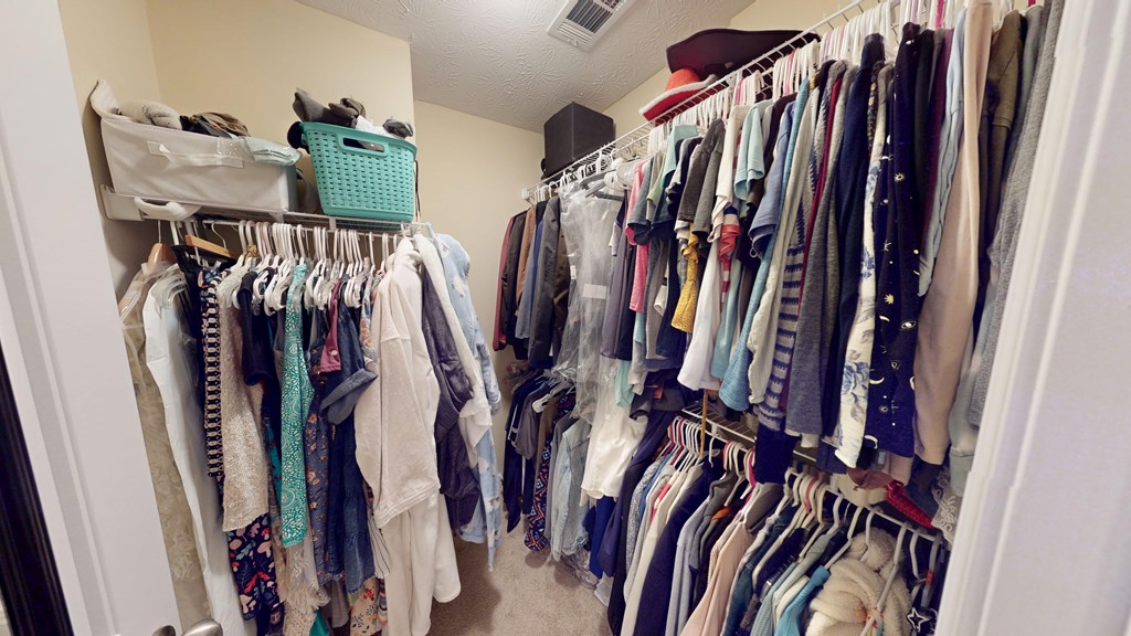 5260 Kingsberry Lane Columbus, GA 31907 - Photo 18 of 23 a view of walk in closet with clothes and shoes
