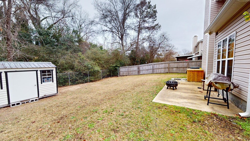 5260 Kingsberry Lane Columbus, GA 31907 - Photo 20 of 23 a view of a backyard with a large tree