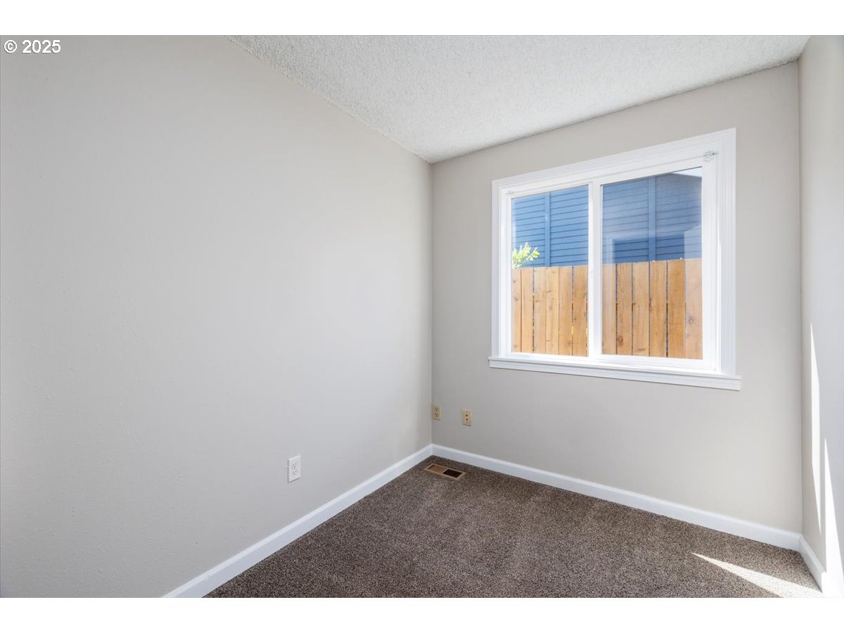 2610 Southwest 204th Avenue Beaverton, OR 97003 - Photo 15 of 37 an empty room with a window