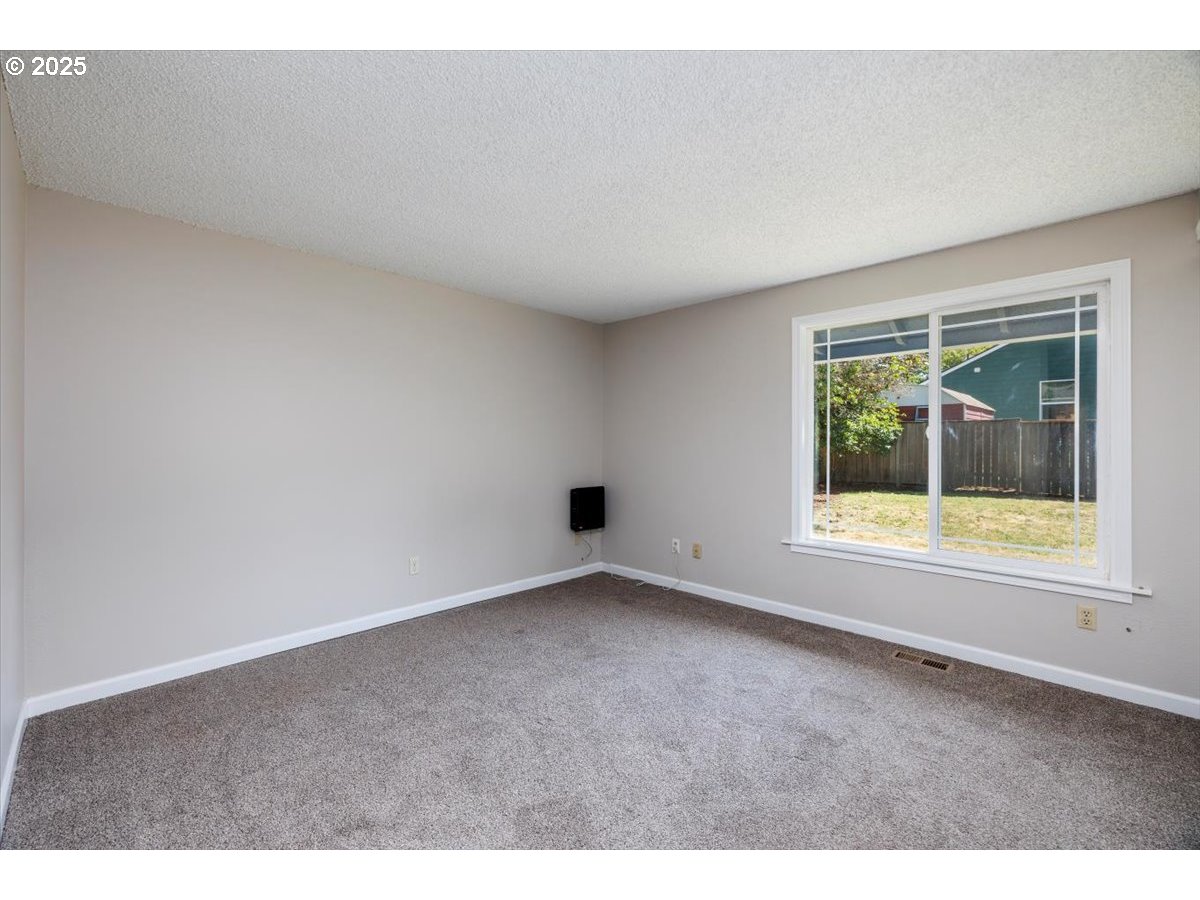2610 Southwest 204th Avenue Beaverton, OR 97003 - Photo 17 of 37 an empty room with a window