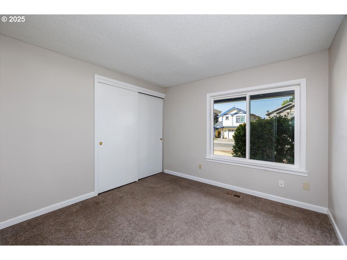 2610 Southwest 204th Avenue Beaverton, OR 97003 - Photo 21 of 37 a view of an empty room with a window
