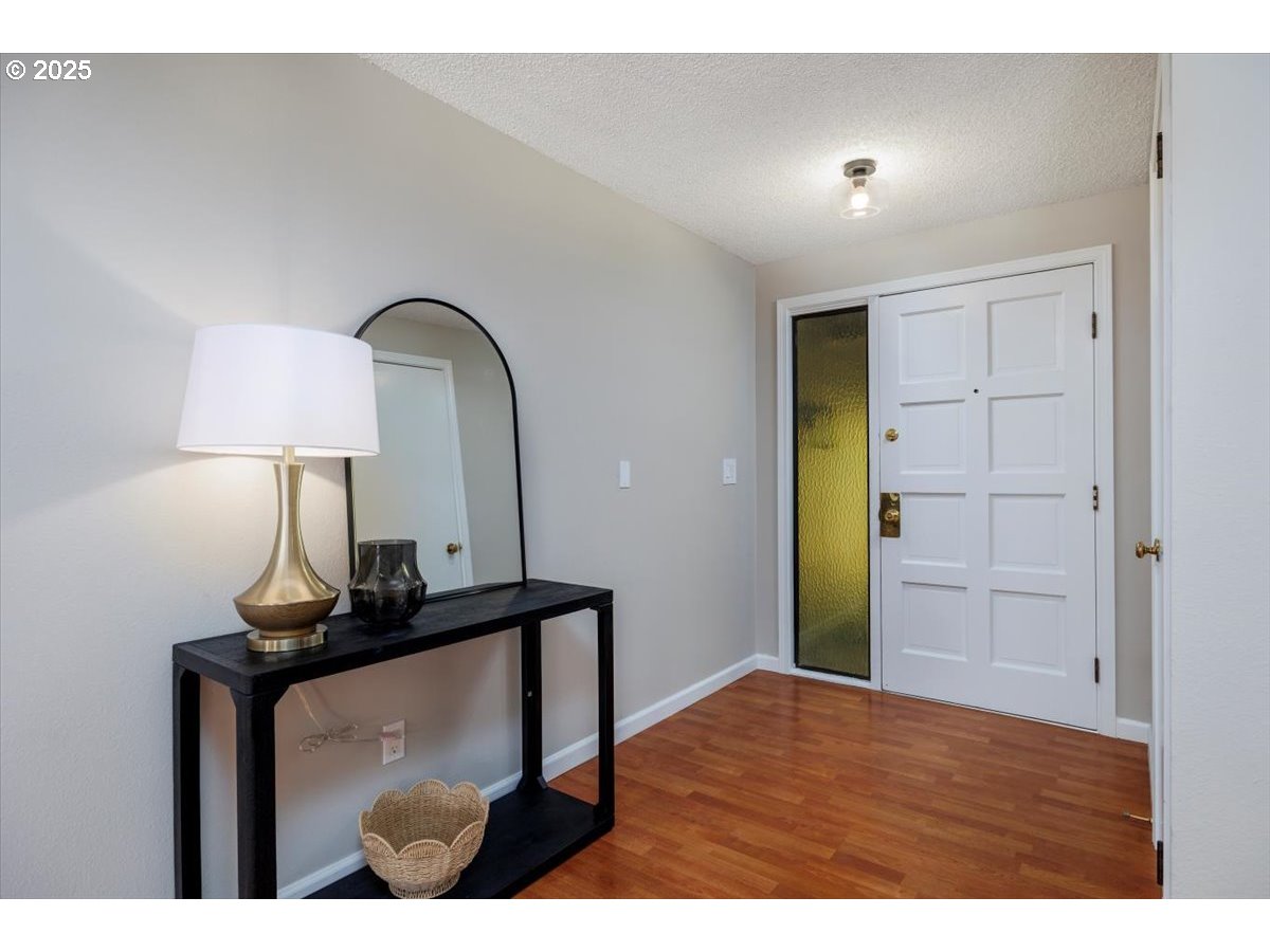 2610 Southwest 204th Avenue Beaverton, OR 97003 - Photo 6 of 37 a bedroom with a bed and a mirror