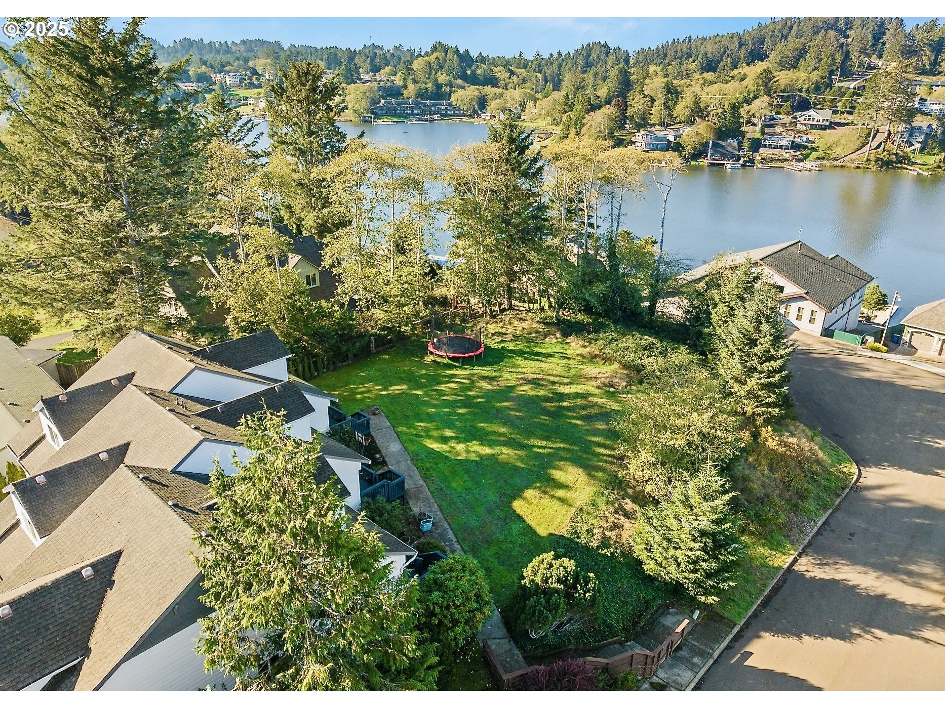 3508 Northeast 40th Court Neotsu, OR 97364 - Photo 1 of 4 an aerial view of residential house with outdoor space and lake view