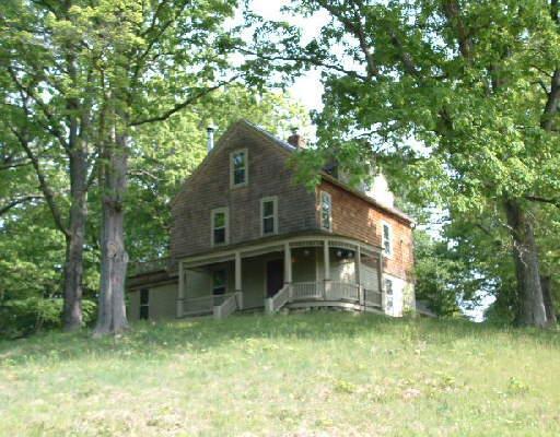 76 Topstone Road Ridgefield, CT 06877 - Photo 1 of 1 a front view of a house with a garden