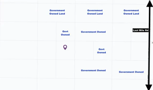 a view of a large mountain with mountains in the background