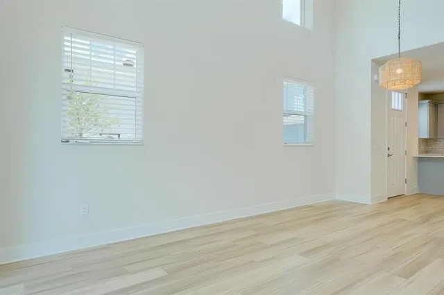a kitchen with granite countertop white cabinets stainless steel appliances and a sink