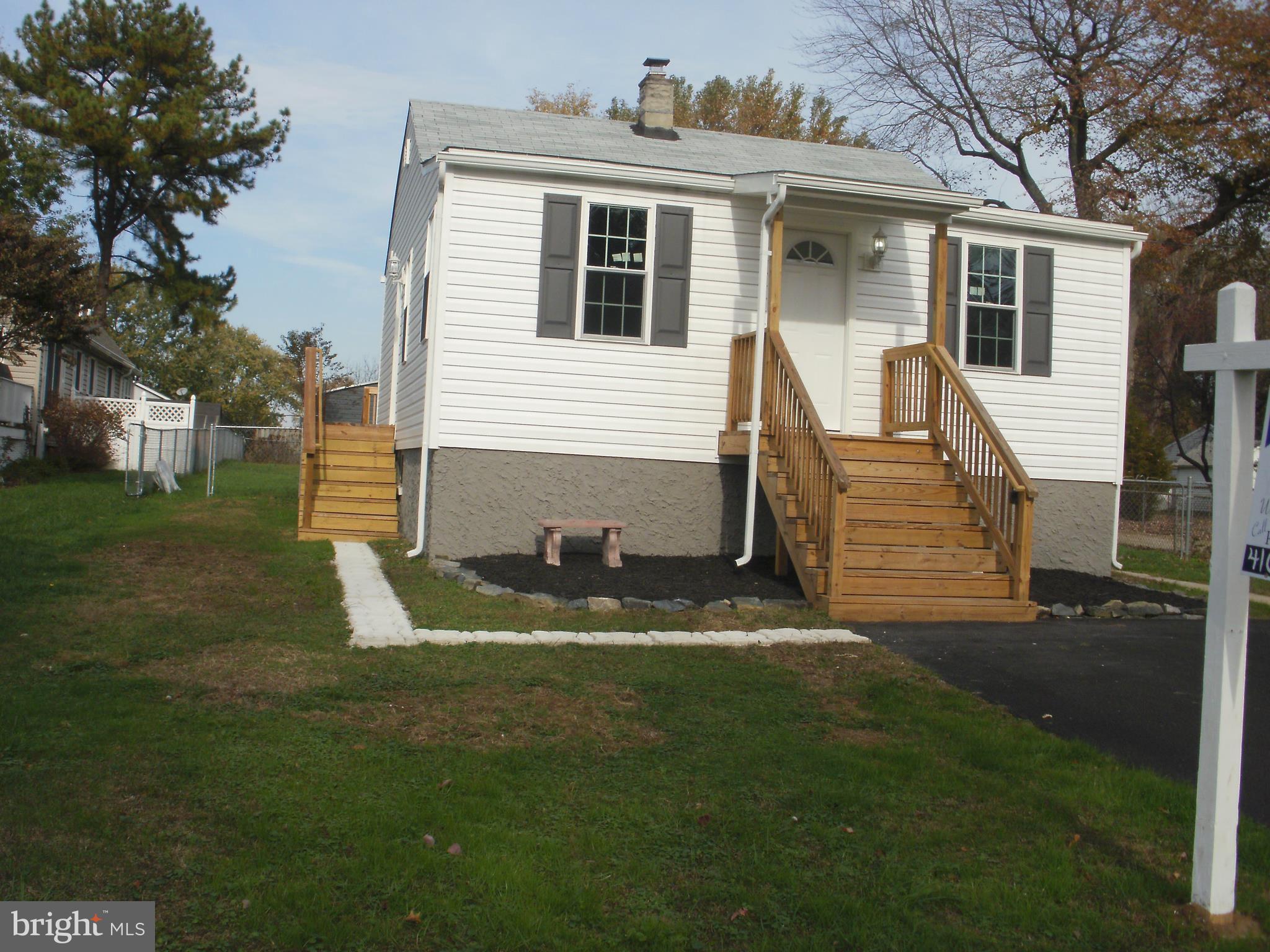 7350 Chesapeake Road Middle River, MD 21220 - Photo 1 of 21 a front view of a house with a yard