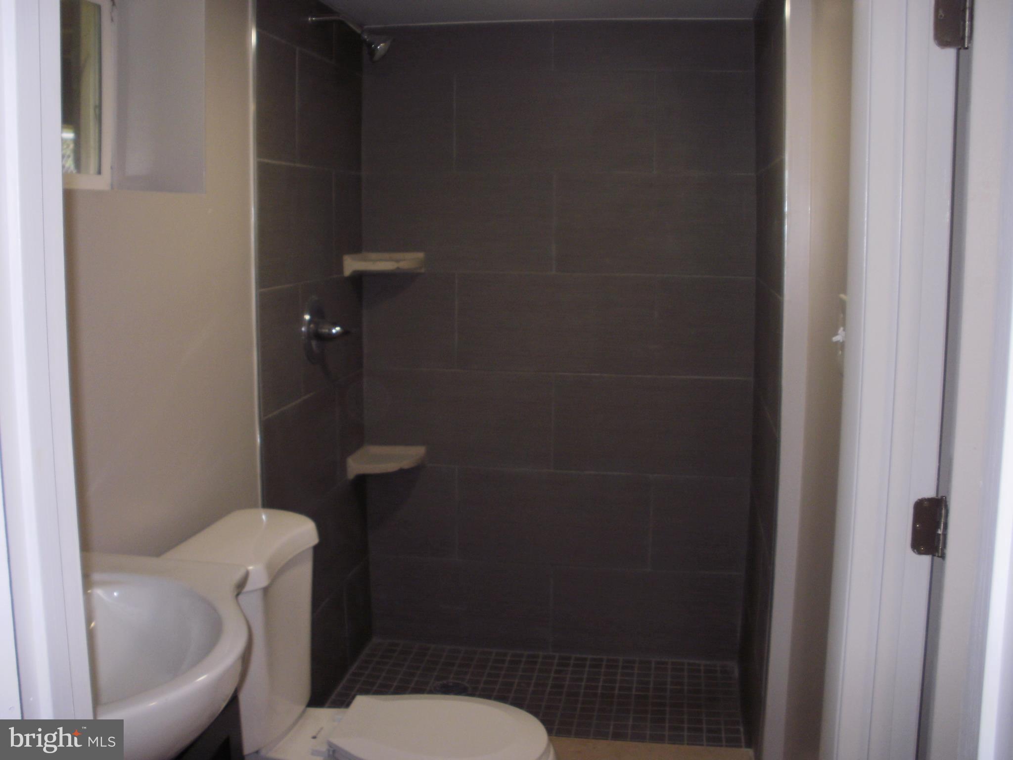 7350 Chesapeake Road Middle River, MD 21220 - Photo 13 of 21 a white toilet sitting next to a bathroom sink