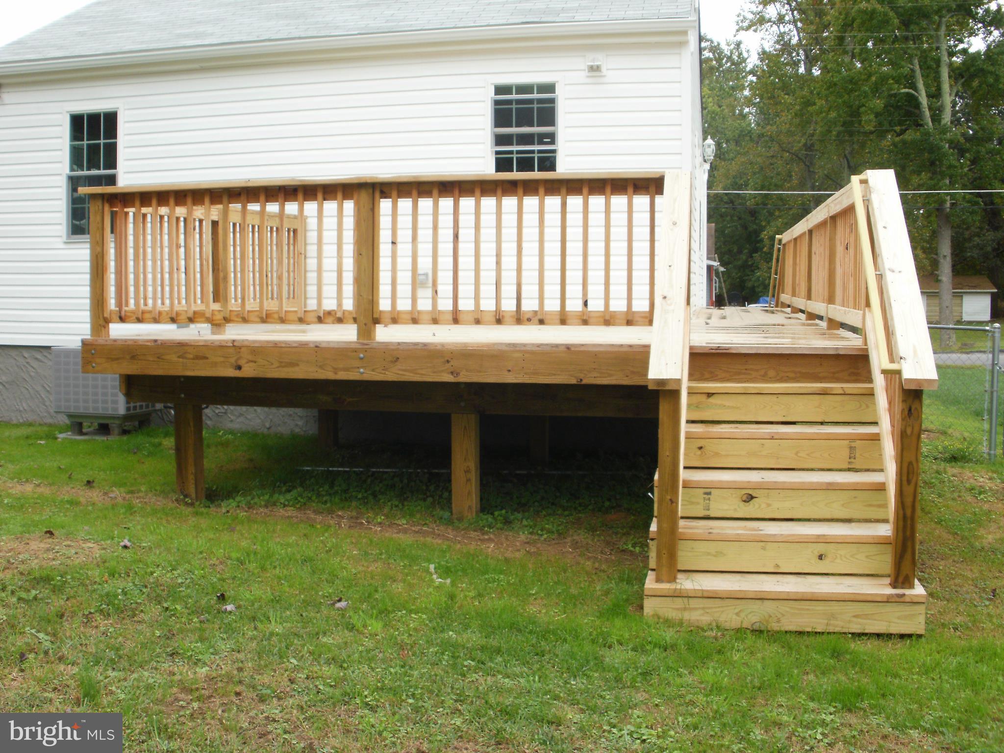 7350 Chesapeake Road Middle River, MD 21220 - Photo 19 of 21 a backyard of a house with wooden floor and outdoor seating