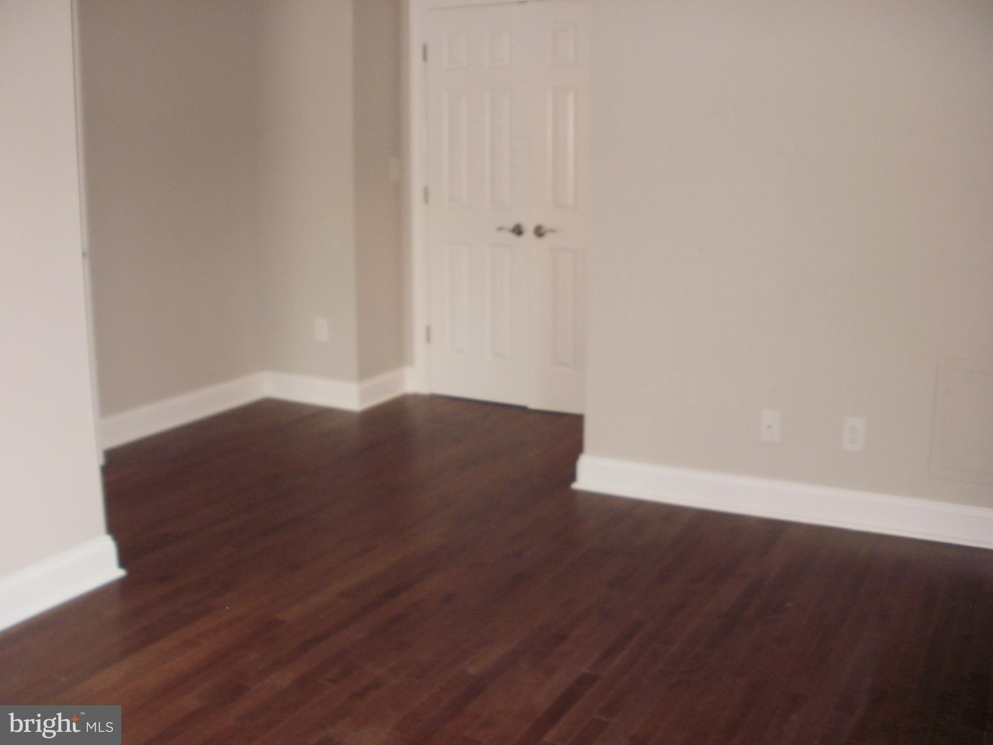 7350 Chesapeake Road Middle River, MD 21220 - Photo 6 of 21 a view of an empty room with wooden floor