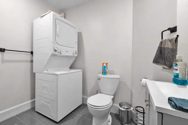 a white toilet sitting next to a bathroom sink