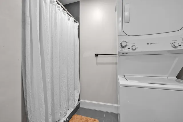 a bathroom with a shower and a mirror