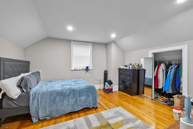 a bed room with a bed and a view of bedroom