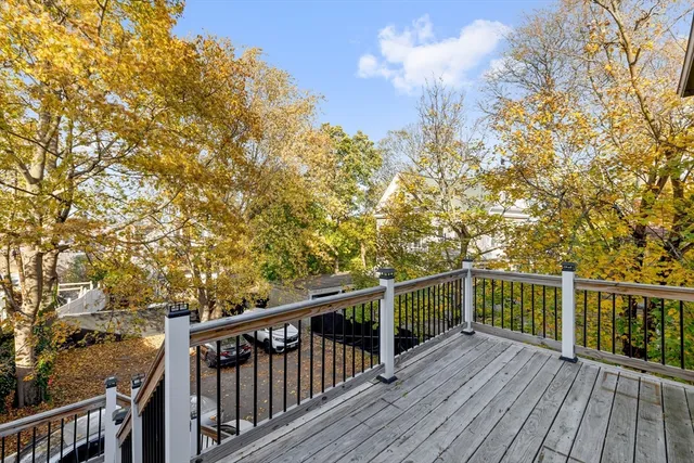 a view of a balcony with wooden floor