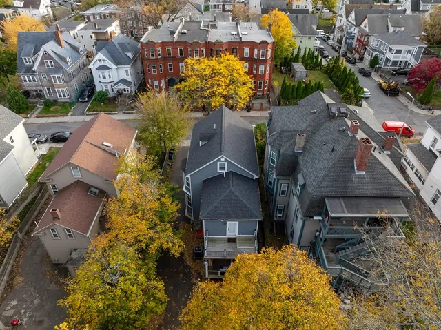 an aerial view of residential houses with outdoor space