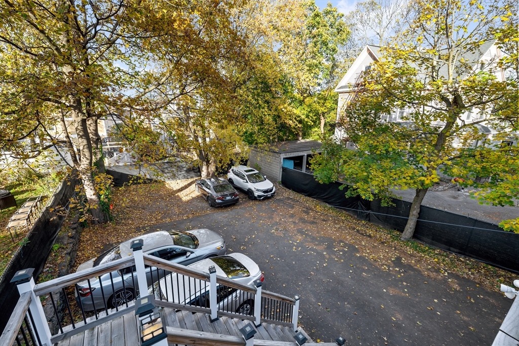 79 West Cottage Street Boston, MA 02125 - Photo 4 of 6 a view of a patio with table and chairs and potted plants