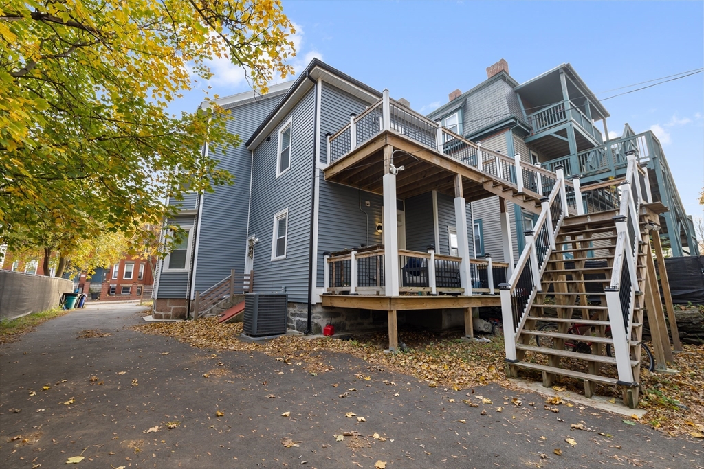 79 West Cottage Street Boston, MA 02125 - Photo 5 of 6 front view of a house with a small yard