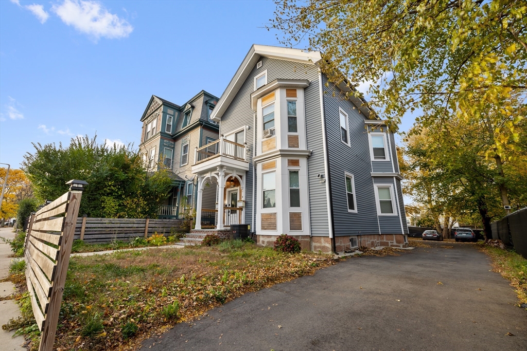 79 West Cottage Street Boston, MA 02125 - Photo 6 of 6 front view of a house with a yard